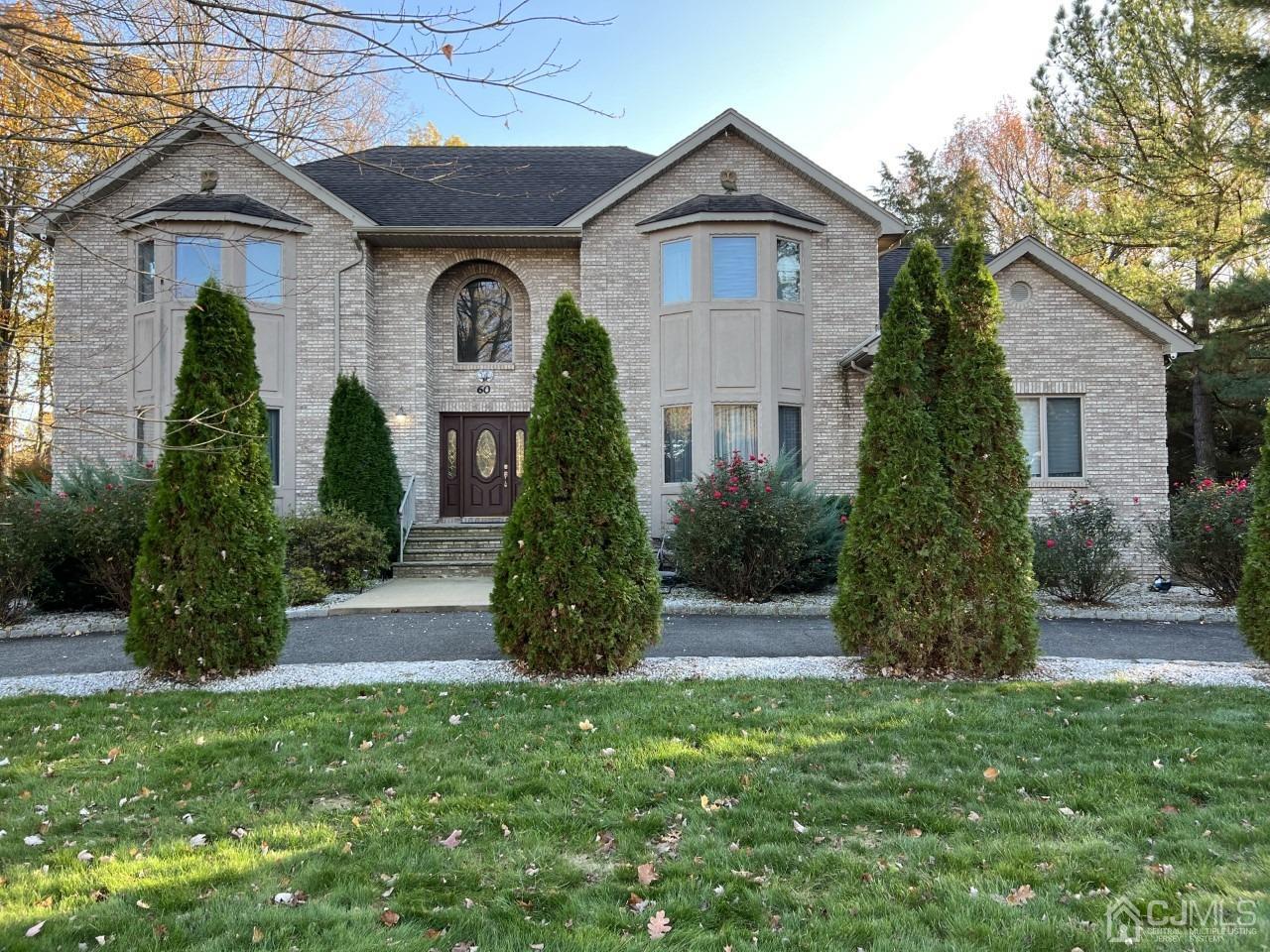 60 Utica Road Edison, NJ 08820 - Photo 1 of 38 a front view of a house with a yard