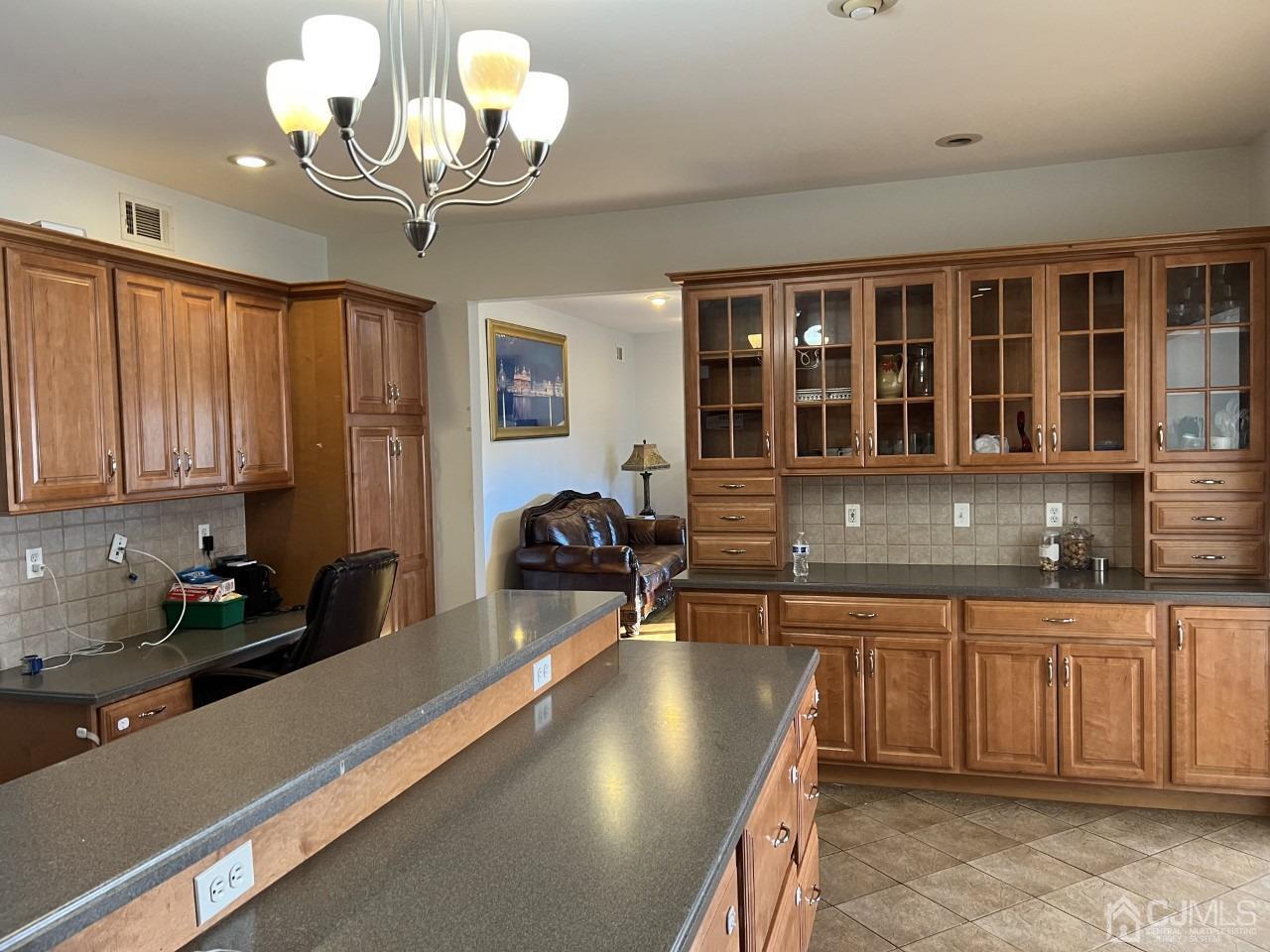 60 Utica Road Edison, NJ 08820 - Photo 11 of 38 a kitchen with a counter space cabinets and appliances