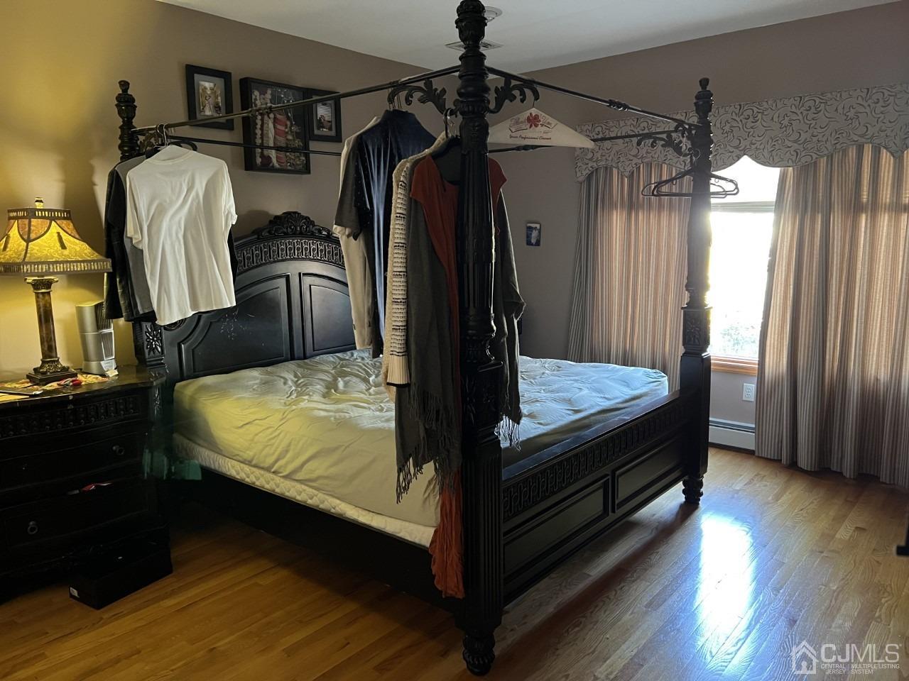 60 Utica Road Edison, NJ 08820 - Photo 14 of 38 a bedroom with bed and wooden floor