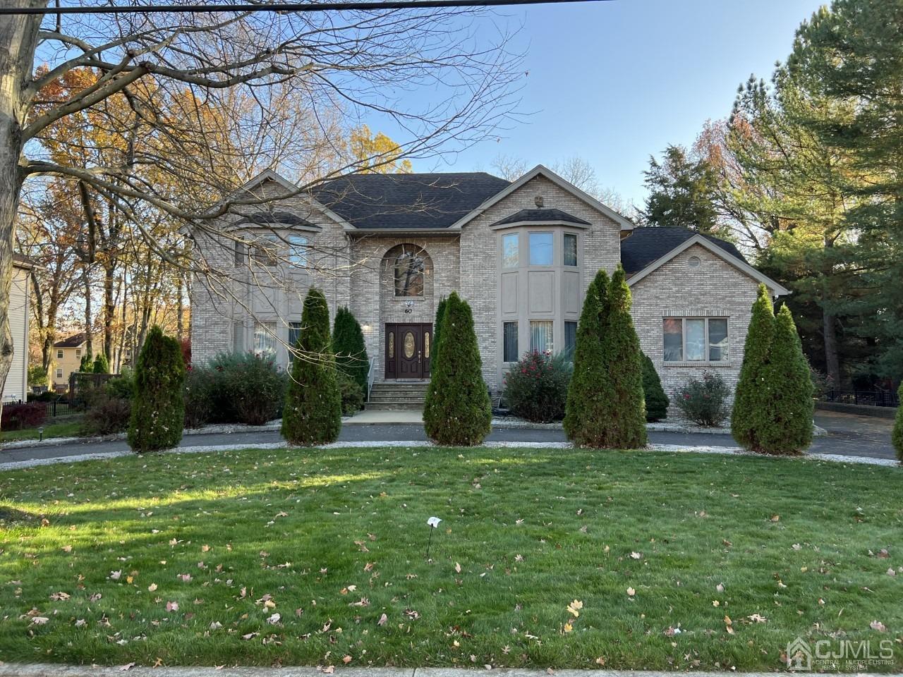60 Utica Road Edison, NJ 08820 - Photo 2 of 38 a front view of a house with a yard