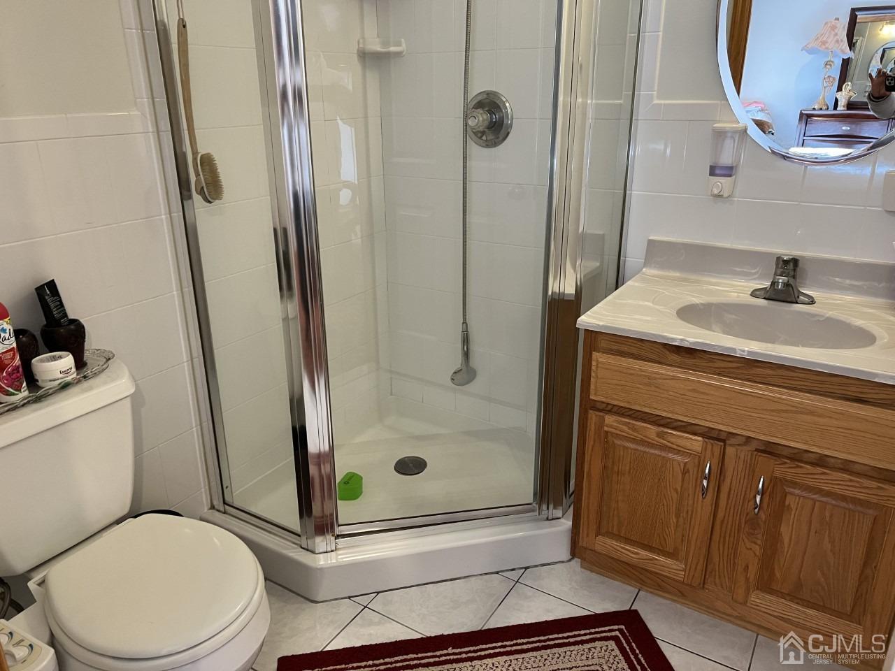 60 Utica Road Edison, NJ 08820 - Photo 24 of 38 a bathroom with a sink toilet and shower