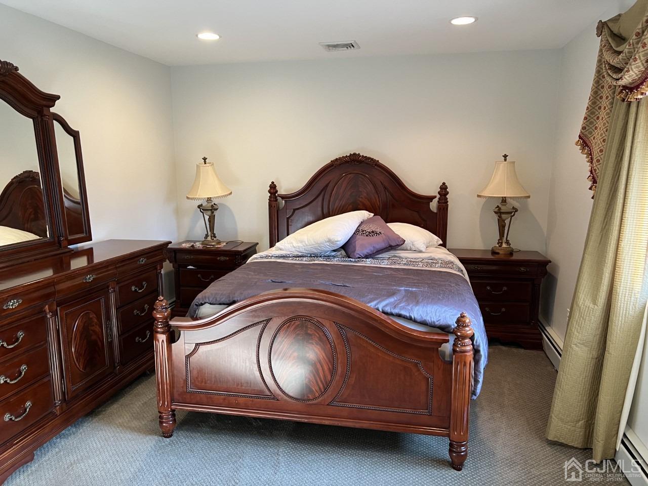 60 Utica Road Edison, NJ 08820 - Photo 25 of 38 a bedroom with a bed and a mirror