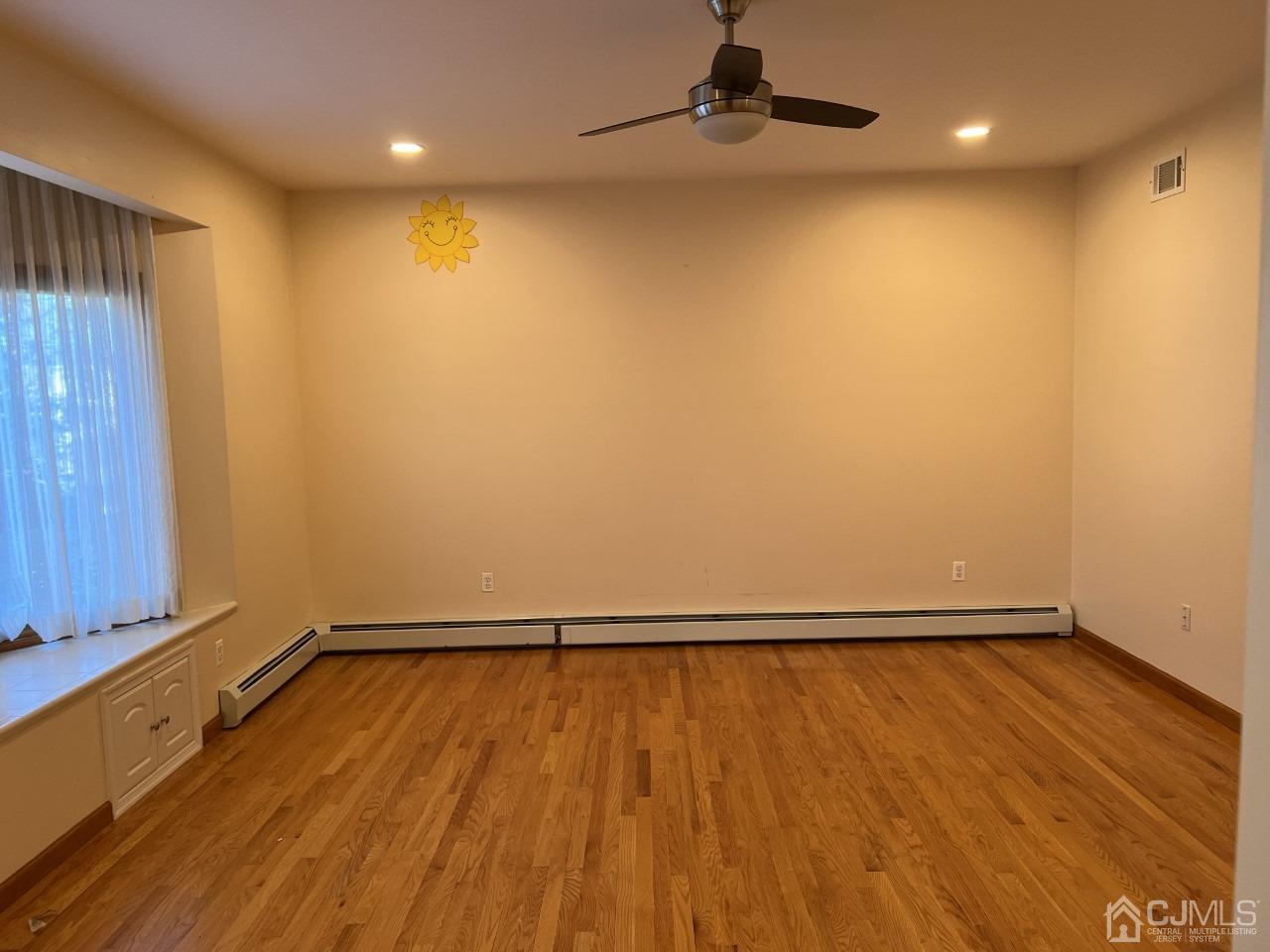 60 Utica Road Edison, NJ 08820 - Photo 5 of 38 a view of a room with wooden floor and small window