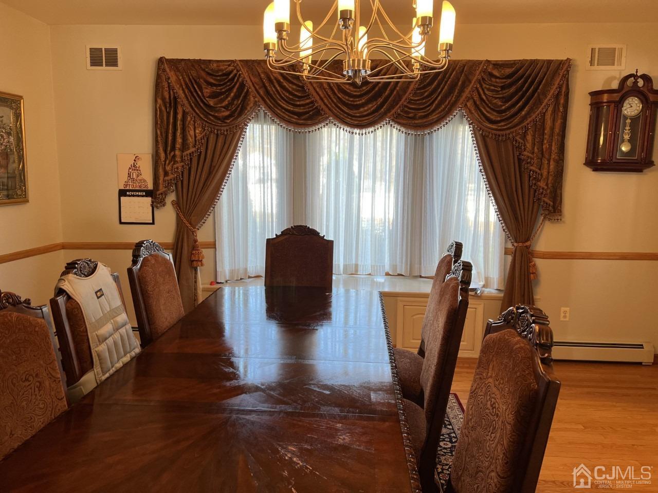 60 Utica Road Edison, NJ 08820 - Photo 7 of 38 a view of walk in closet with clothes and shoes