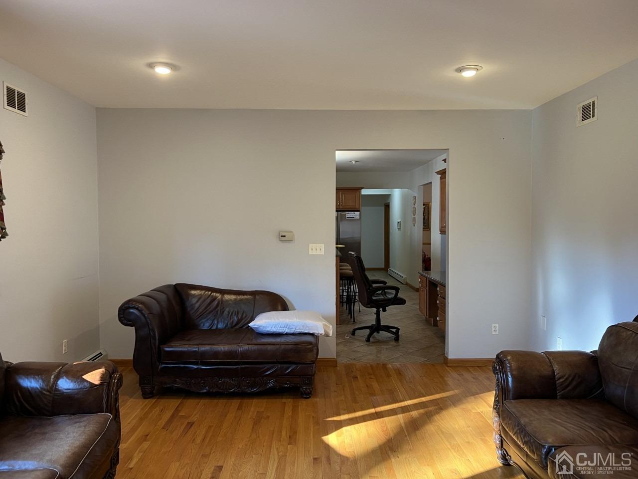 60 Utica Road Edison, NJ 08820 - Photo 10 of 38 a living room with furniture and a couch