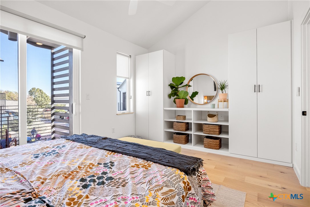 1909 Dutton Drive, Unit B San Marcos, TX 78666 - Photo 11 of 25 a bedroom with a bed and a window