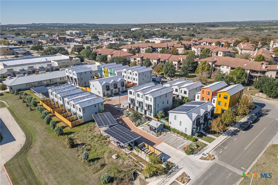 1909 Dutton Drive, Unit B San Marcos, TX 78666 - Photo 18 of 25 an aerial view of a house with a swimming pool outdoor seating and yard