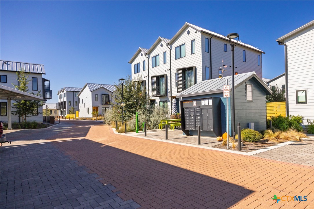 1909 Dutton Drive, Unit B San Marcos, TX 78666 - Photo 19 of 25 a view of a building with a street