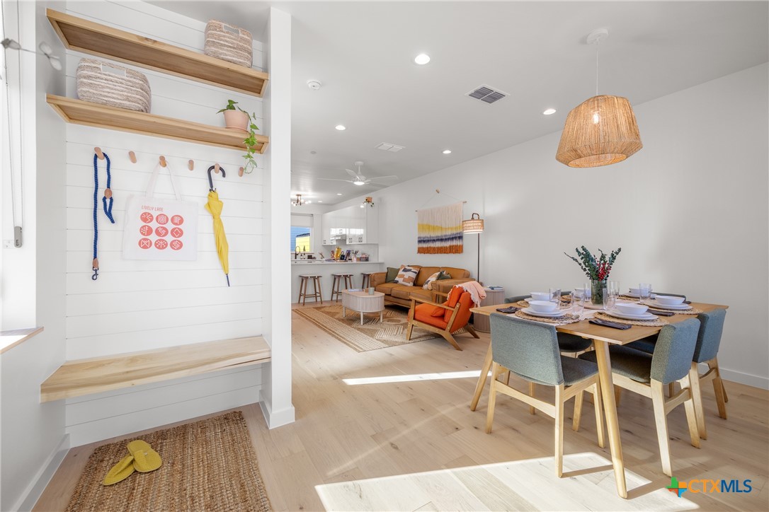 1909 Dutton Drive, Unit B San Marcos, TX 78666 - Photo 2 of 25 a view of a dining room with furniture and chandelier