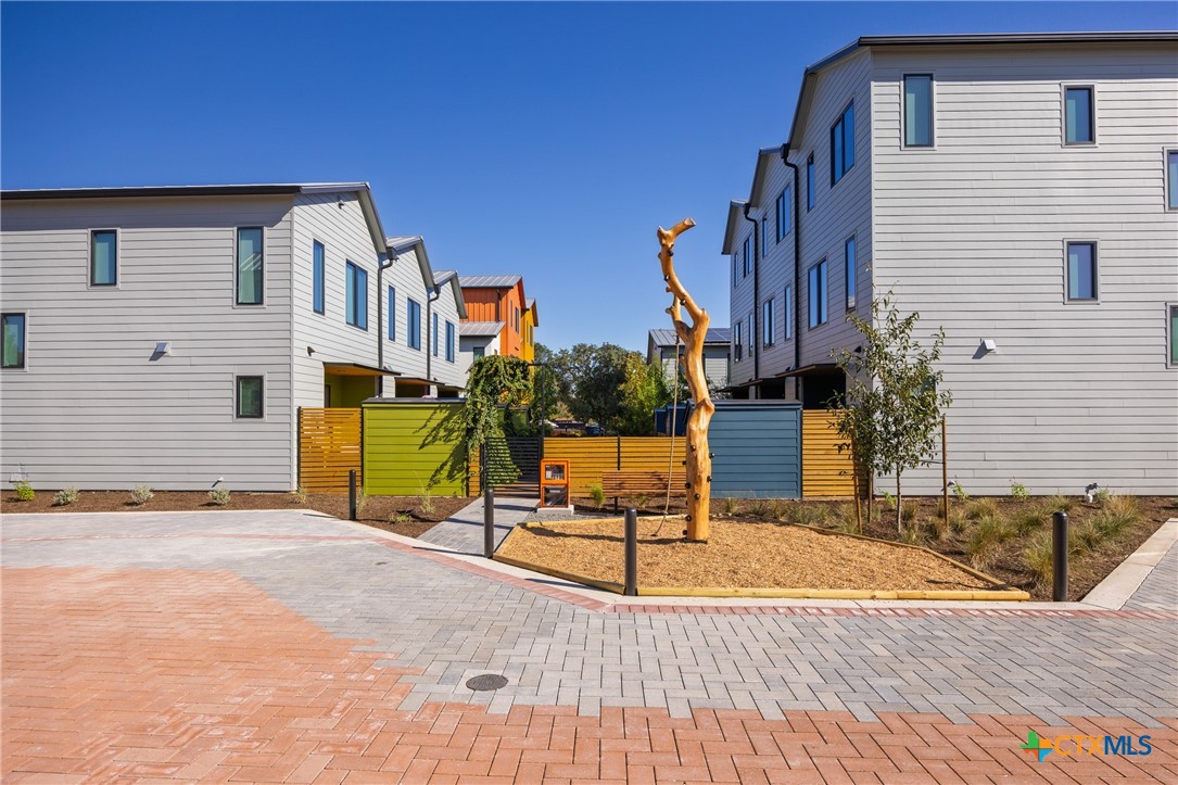 1909 Dutton Drive, Unit B San Marcos, TX 78666 - Photo 21 of 25 a view of a house with wooden fence