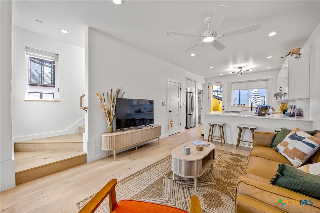 1909 Dutton Drive, Unit B San Marcos, TX 78666 - Photo 3 of 25 a living room with furniture and a flat screen tv