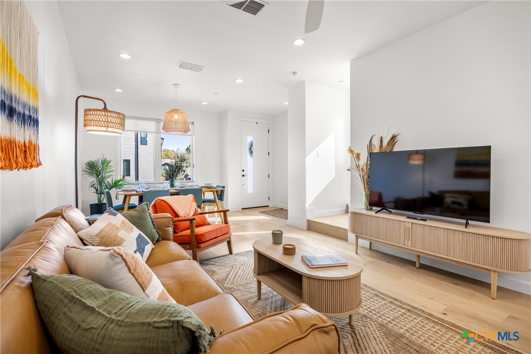 1909 Dutton Drive, Unit B San Marcos, TX 78666 - Photo 4 of 25 a living room with furniture and a flat screen tv