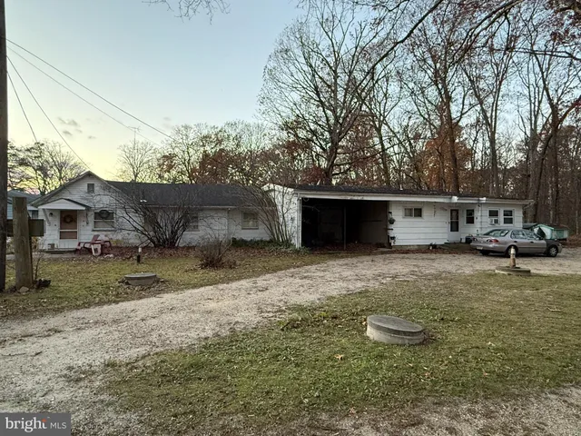 a view of a backyard with sitting area