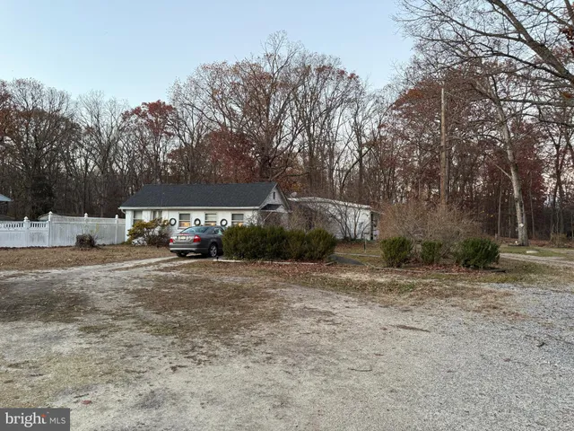 a view of a house with a yard and garage