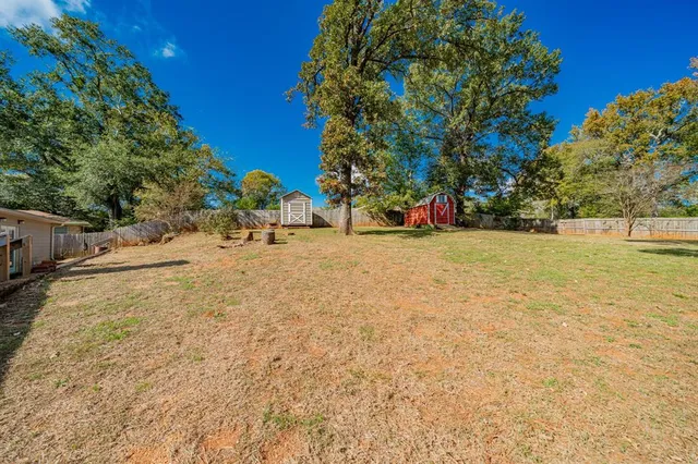 a view of a playground with basketball court