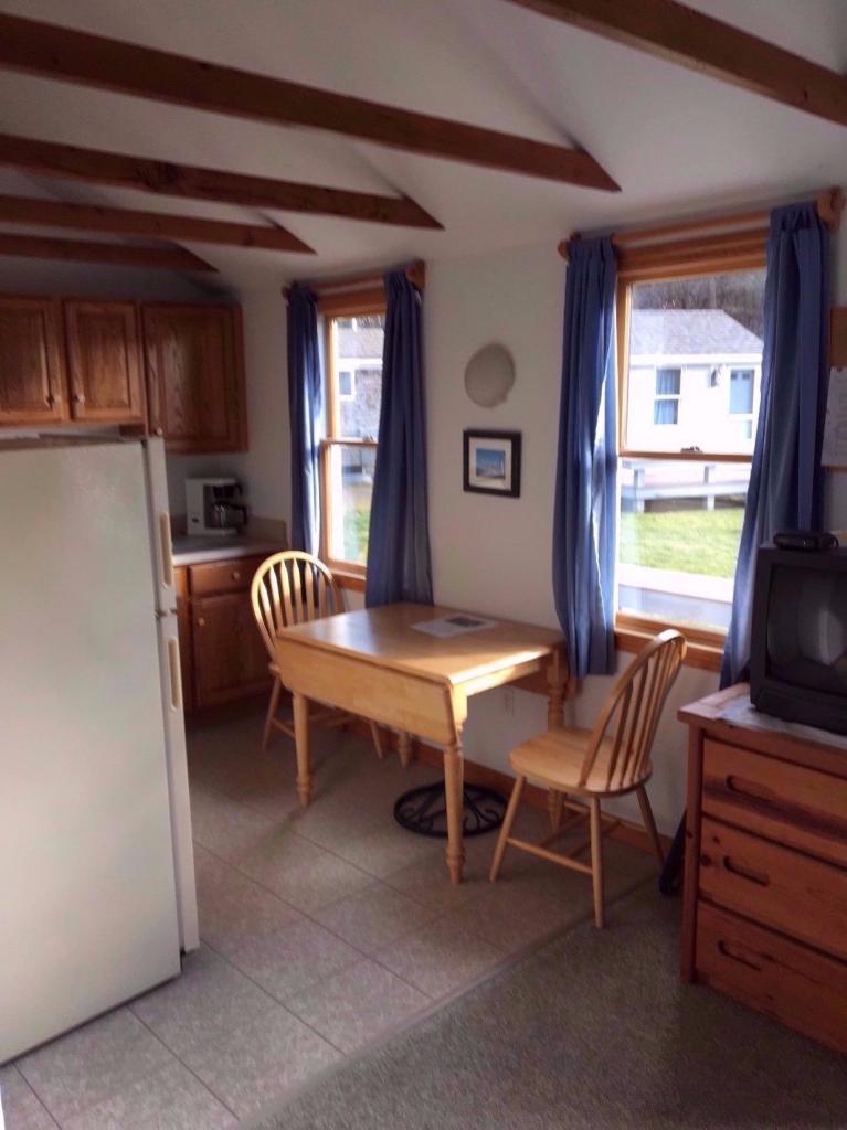 121 Shore Road, Unit 2 Truro, MA 02666 - Photo 3 of 6 a dining room with furniture and window