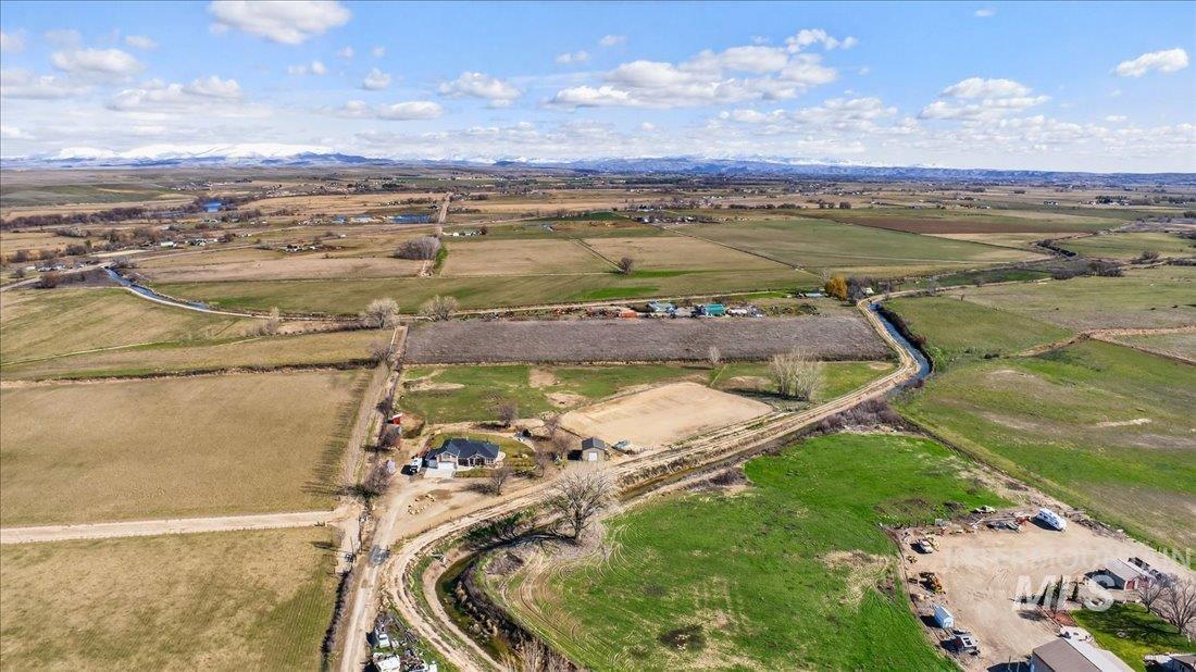 5408 Cassia Road New Plymouth, ID 83655 - Photo 29 of 49 Aerial view of property and surrounding area featuring rural landscape and a mountainous background