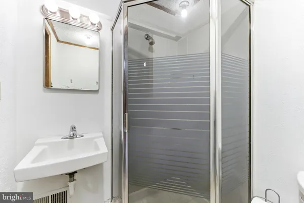 a bathroom with a sink and mirror