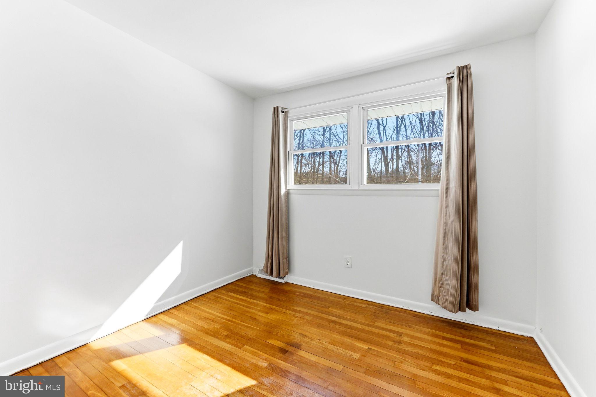 623 Chapelgate Drive Odenton, MD 21113 - Photo 14 of 24 a view of empty room with wooden floor