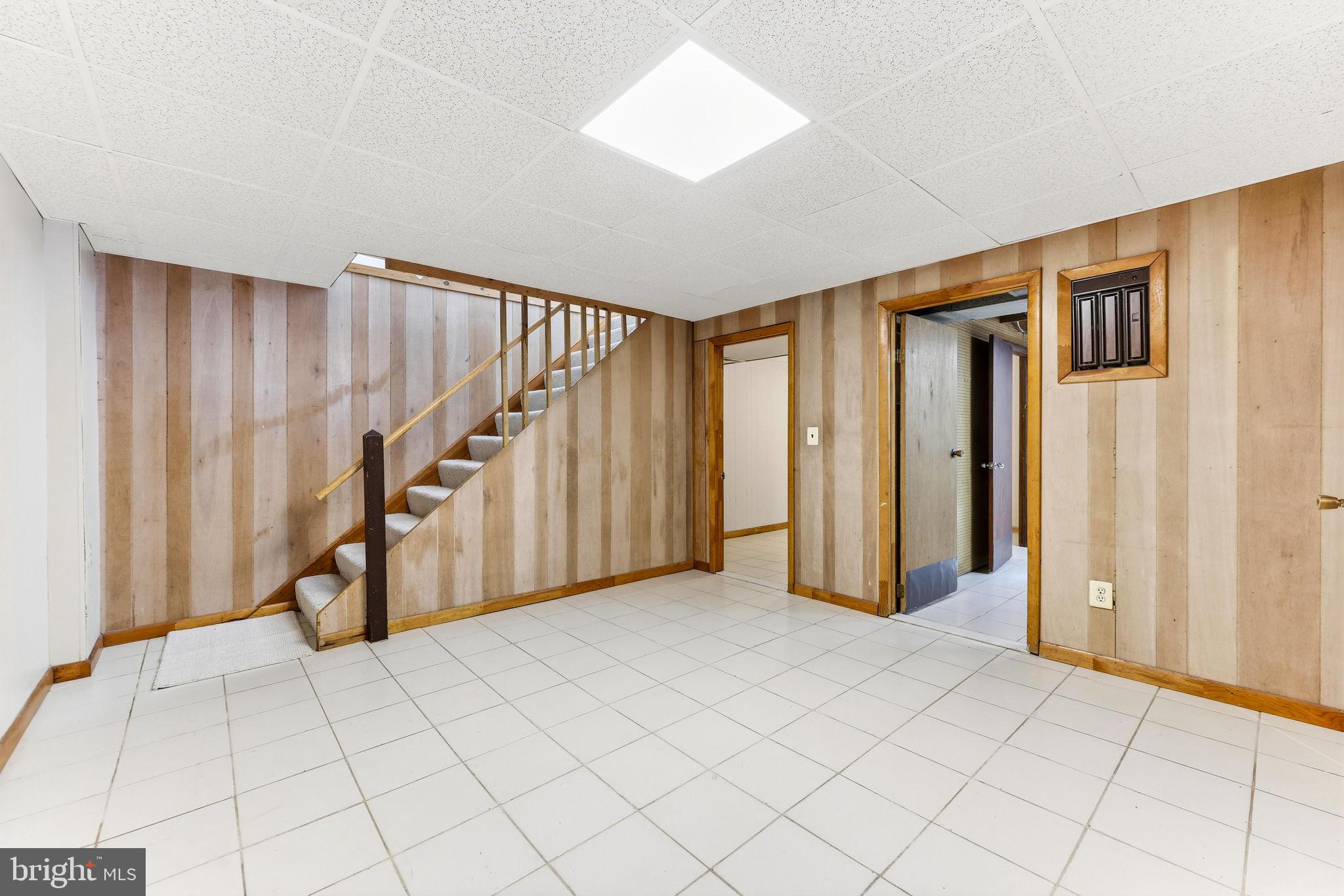 623 Chapelgate Drive Odenton, MD 21113 - Photo 19 of 24 a view of an empty room with wooden floor