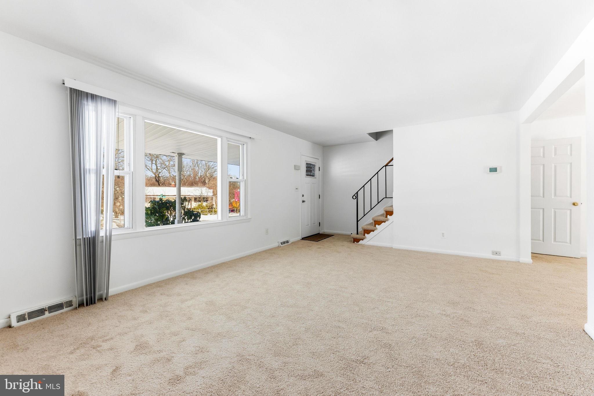 623 Chapelgate Drive Odenton, MD 21113 - Photo 3 of 24 an empty room with windows & dryer