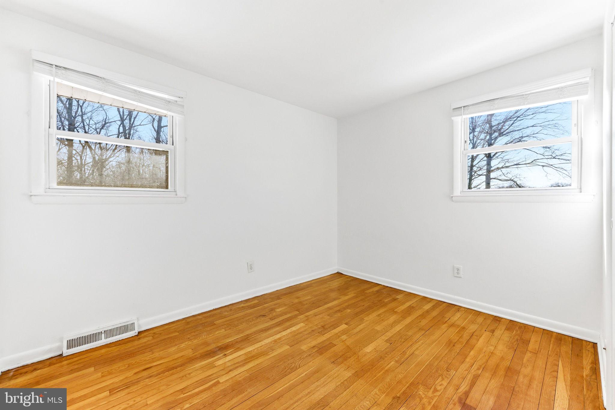 623 Chapelgate Drive Odenton, MD 21113 - Photo 10 of 24 a view of empty room with wooden floor