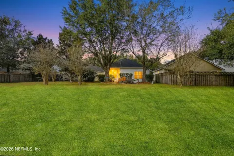 a view of a house with a big yard
