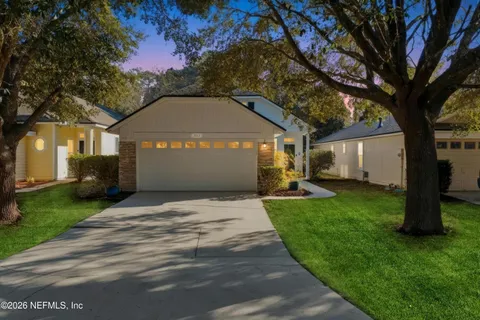 a view of house with yard