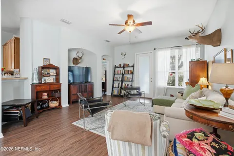 a living room with furniture and a flat screen tv