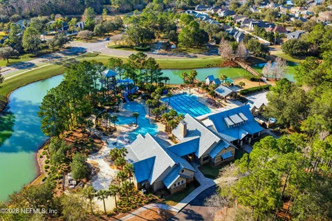an aerial view of multiple houses with yard