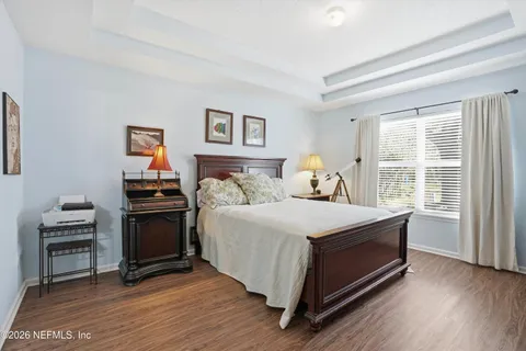 a bedroom with a bed and a desk