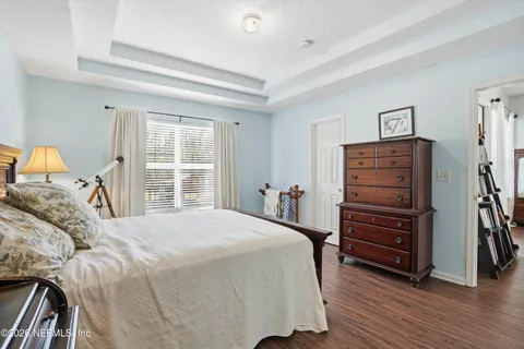 a bedroom with a bed and a closet