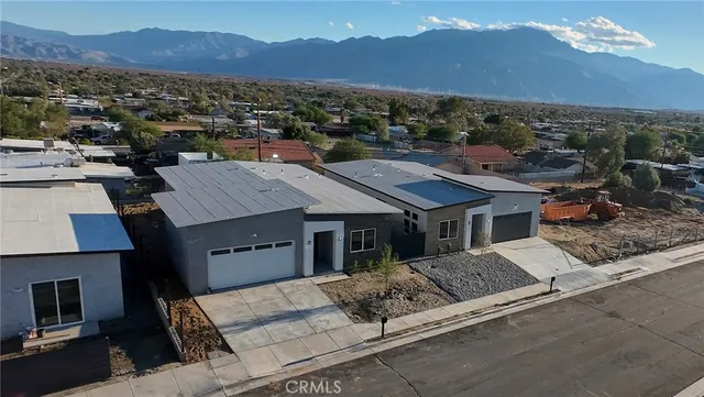 a view of a house with a street