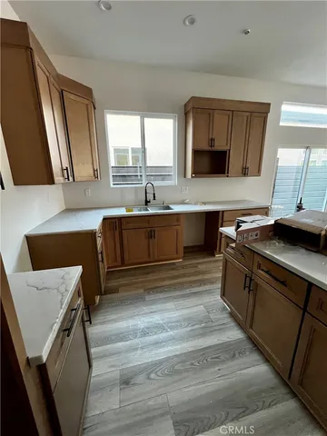 a spacious bathroom with a granite countertop sink and a mirror
