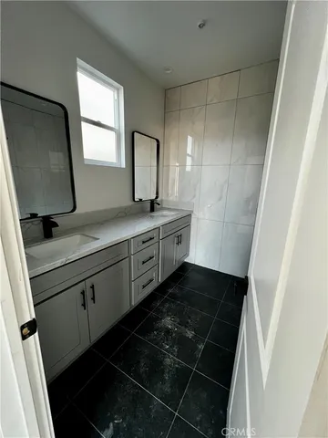 a view of a sink and a mirror in bathroom