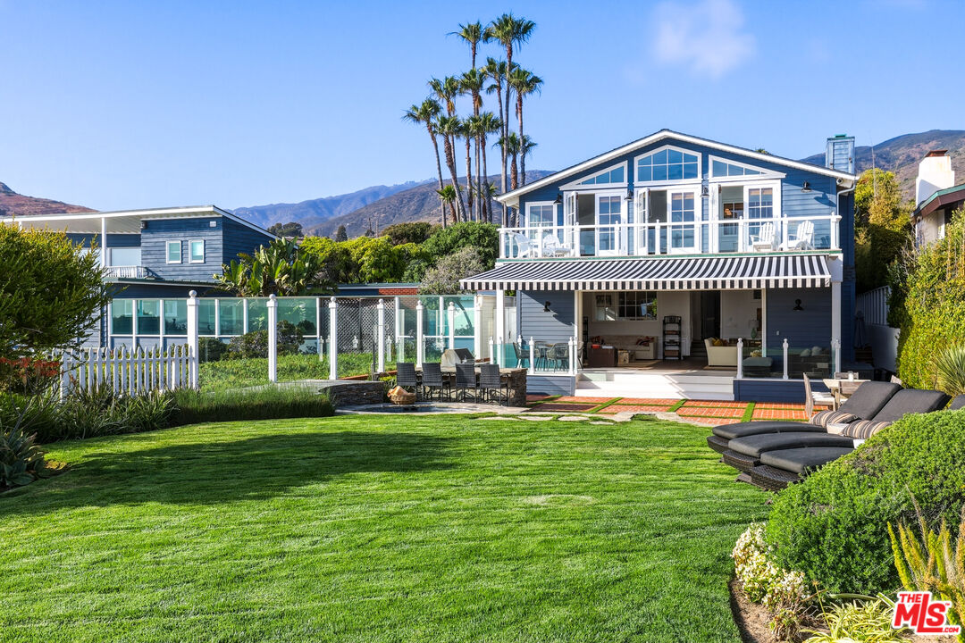30810 Broad Beach Road Malibu, CA 90265 - Photo 2 of 55 a front view of a house with swimming pool having outdoor seating