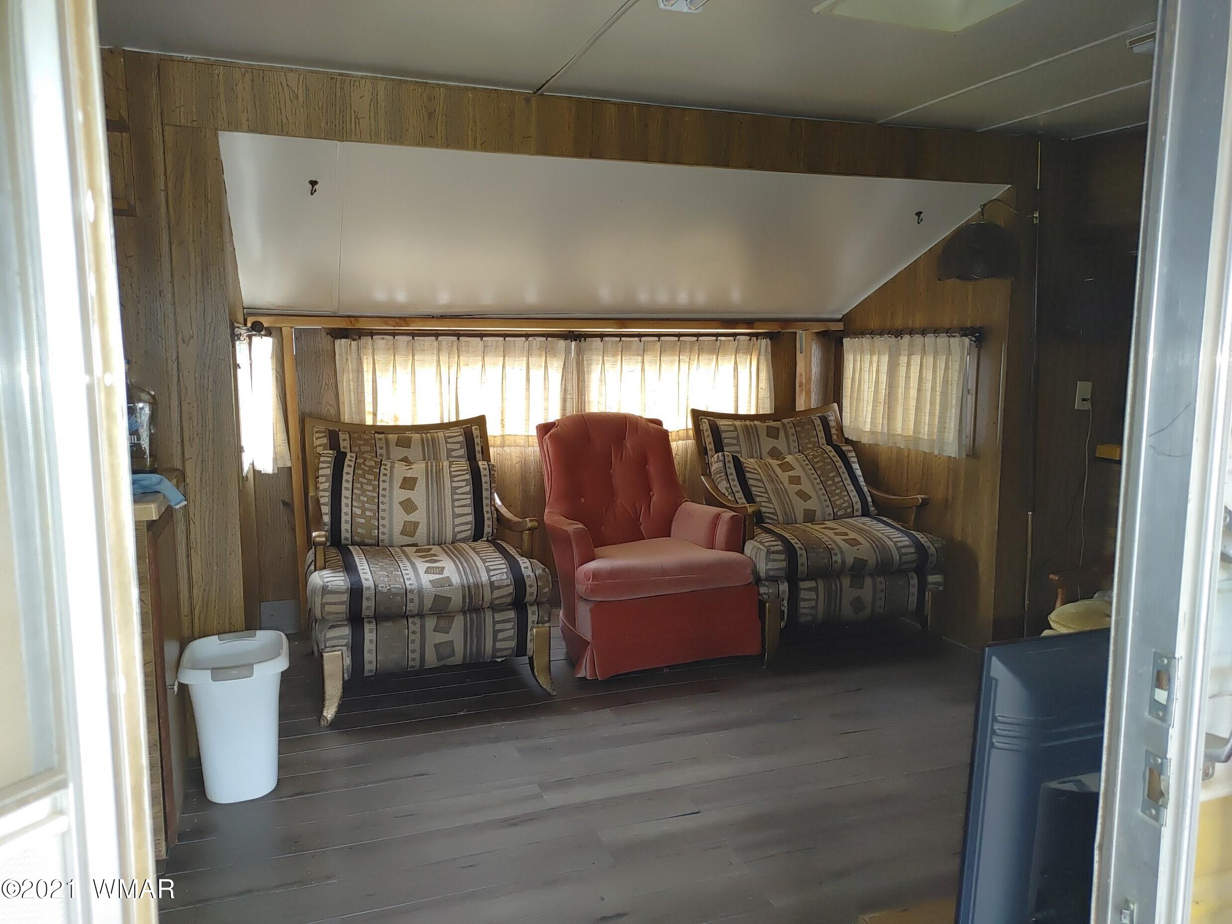 3524 Quail Run Road Overgaard, AZ 85933 - Photo 3 of 24 a living room with furniture and a window