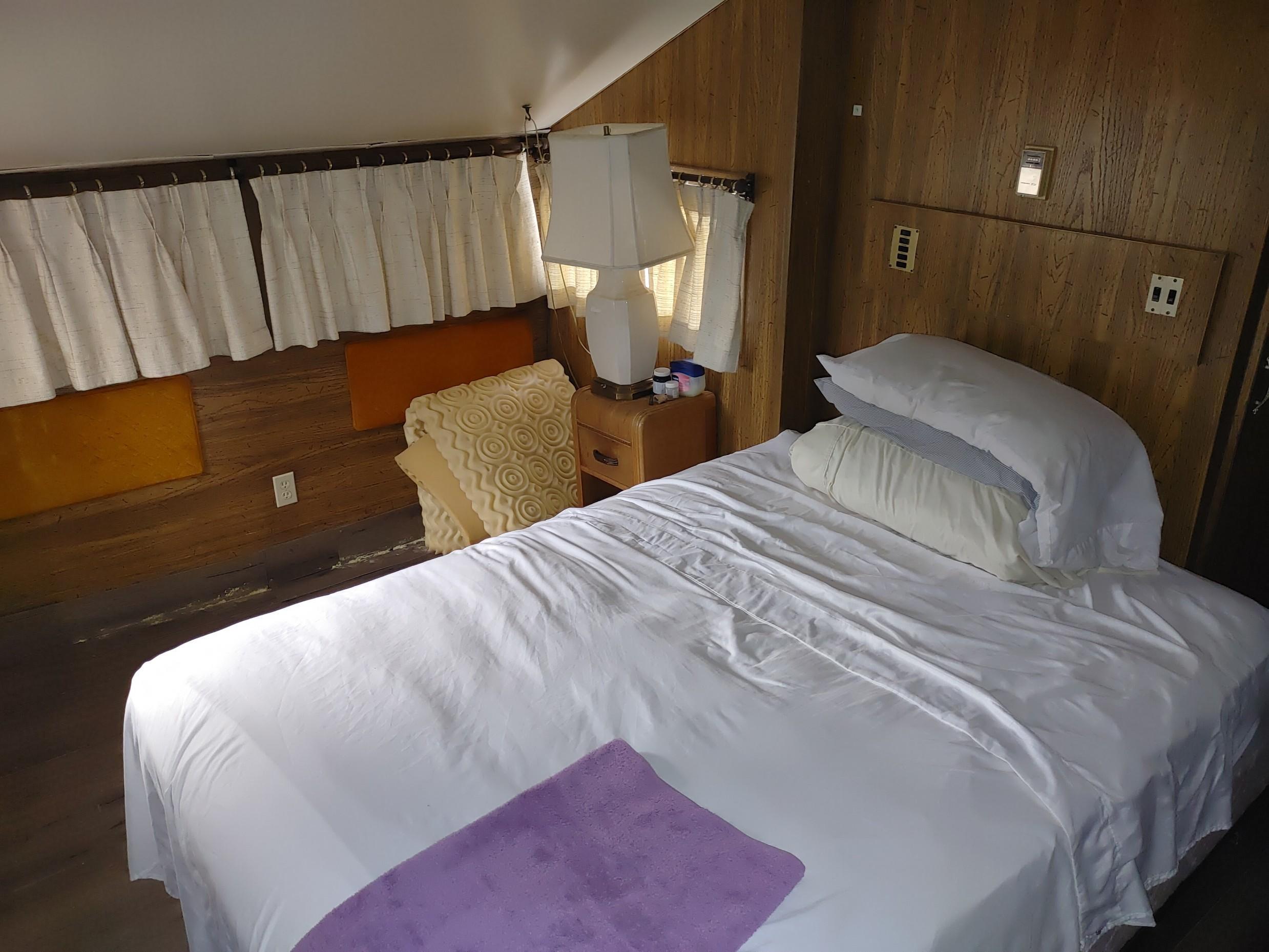 3524 Quail Run Road Overgaard, AZ 85933 - Photo 7 of 24 a bedroom with a bed and wooden floor