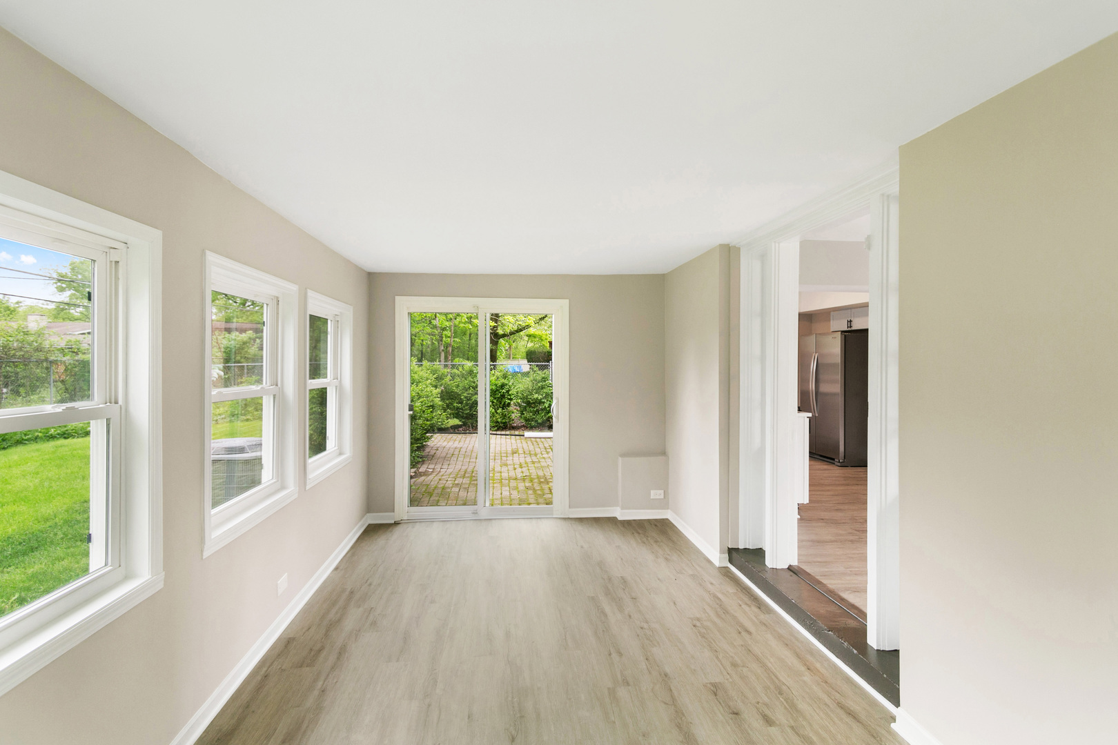 239 Cornwall Drive Crete, IL 60417 - Photo 11 of 25 wooden floor in an empty room with a window