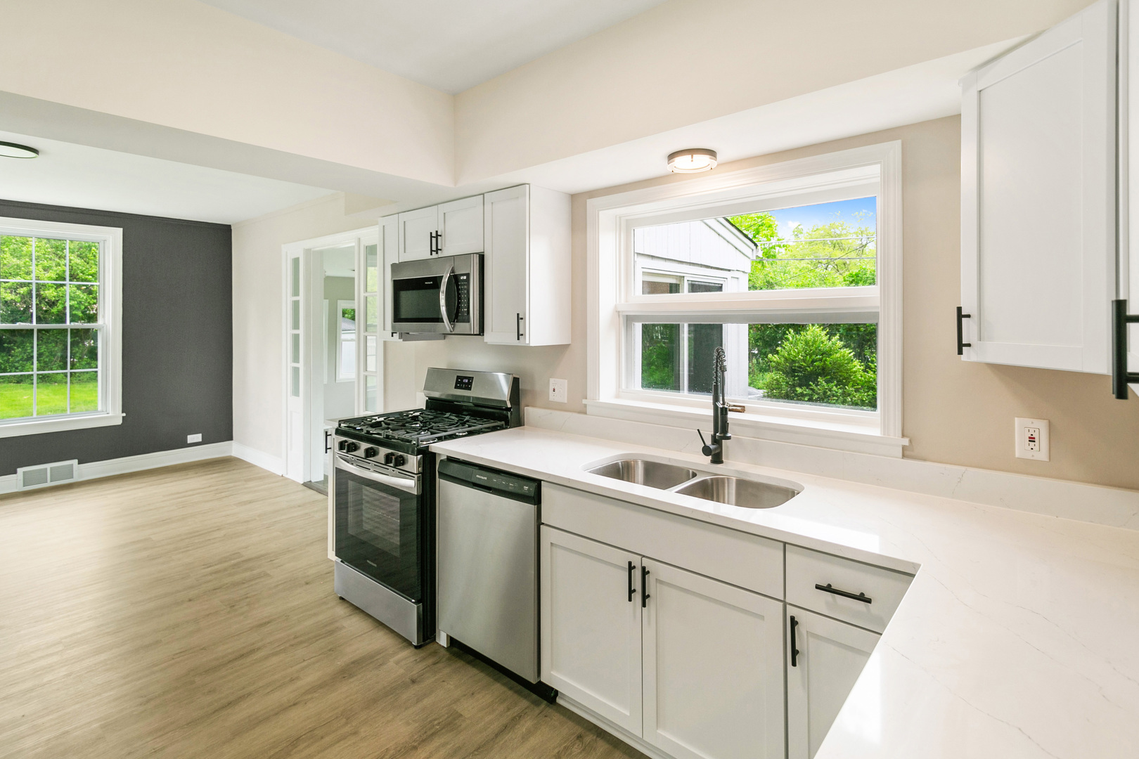 239 Cornwall Drive Crete, IL 60417 - Photo 13 of 25 a kitchen with a sink and a stove top oven