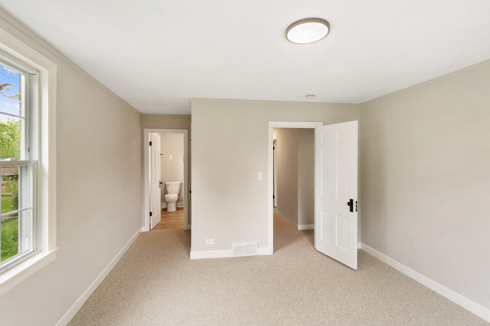 239 Cornwall Drive Crete, IL 60417 - Photo 22 of 25 an empty room with windows and closet