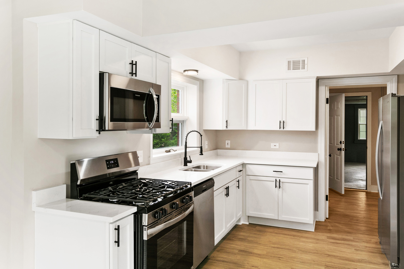 239 Cornwall Drive Crete, IL 60417 - Photo 8 of 25 a kitchen with a sink stove top oven and cabinets