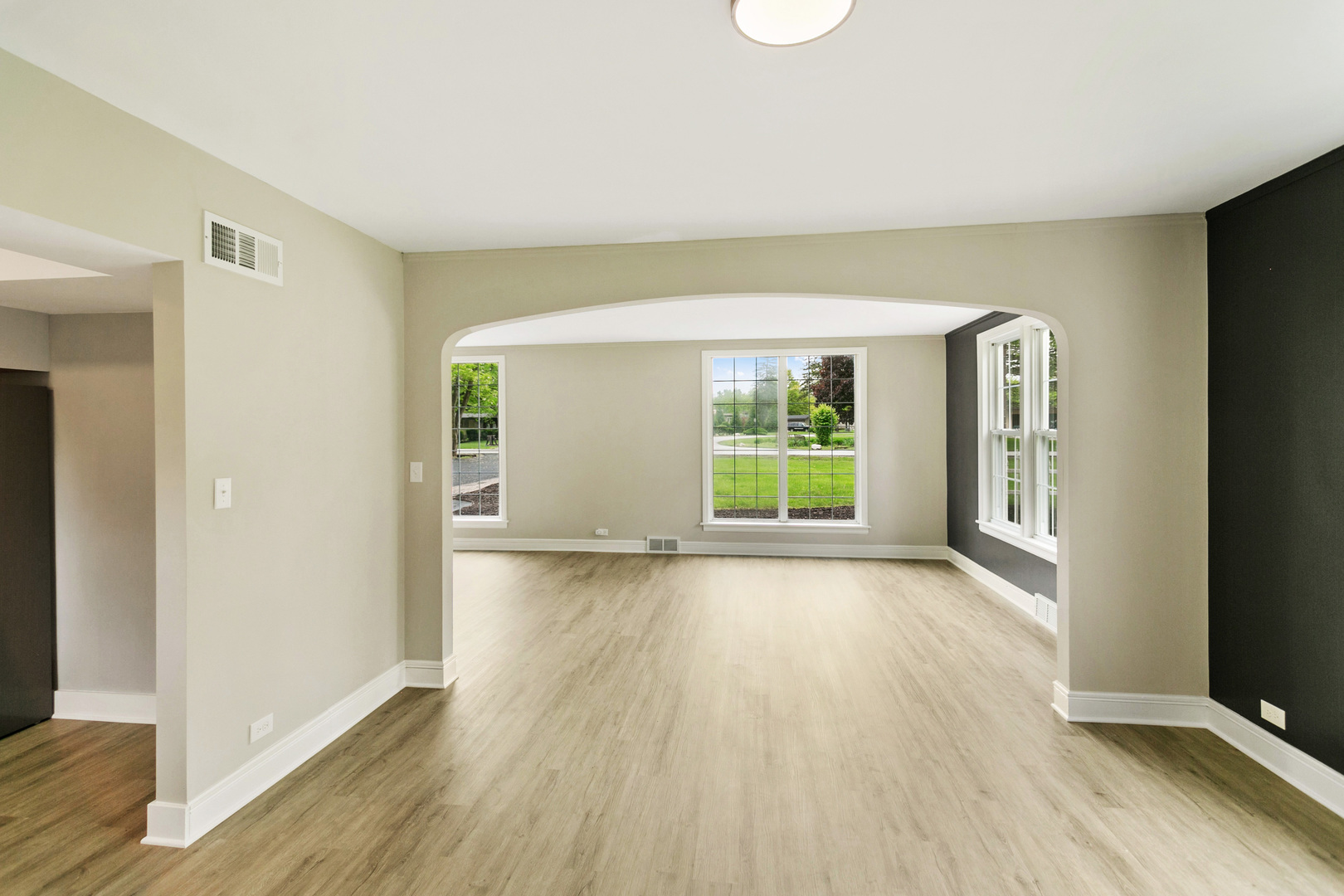239 Cornwall Drive Crete, IL 60417 - Photo 9 of 25 a view of an empty room with wooden floor and a window