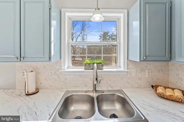 a kitchen with a sink and a window