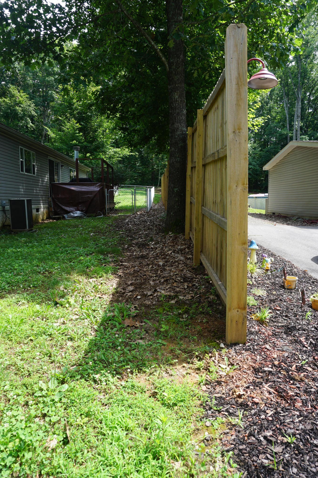 126 Laura Boling Loop Road Strawberry Plains, TN 37871 - Photo 38 of 40 8 ft. privacy fence.