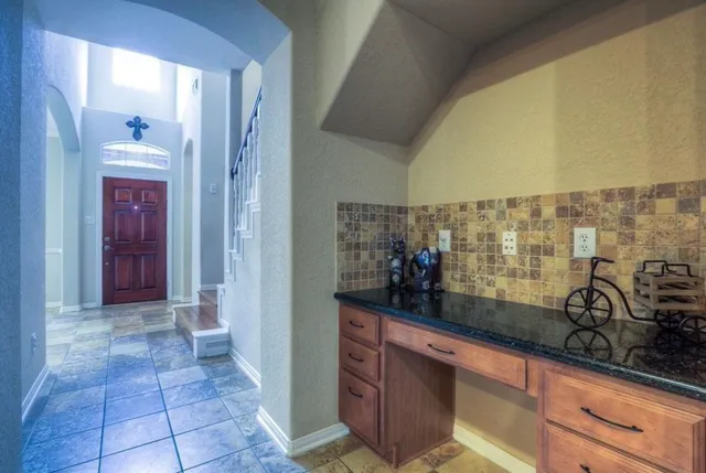a view of bathroom with sink and mirror