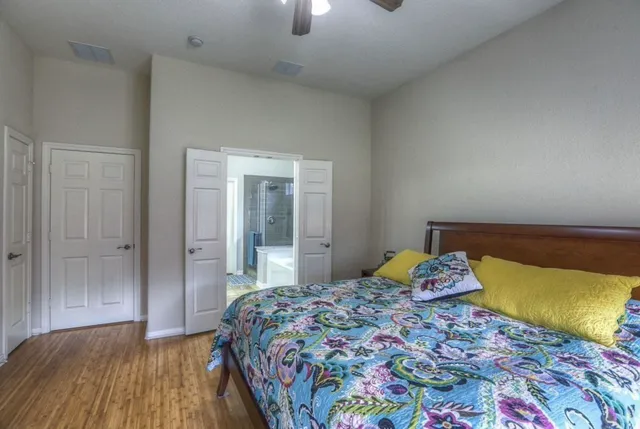 a bedroom with a bed and a lamp