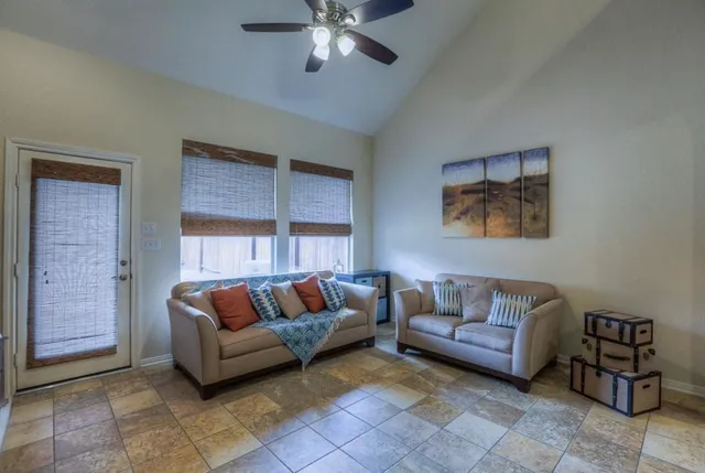 a living room with furniture and a rug