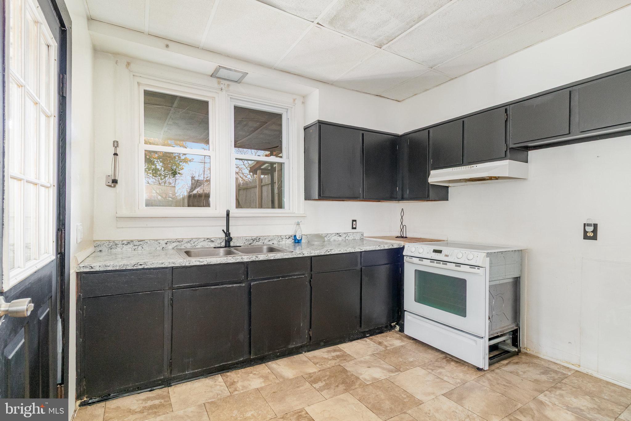 248 South 5th Street Lebanon, PA 17042 - Photo 17 of 35 Modern kitchen with sleek black cabinetry.