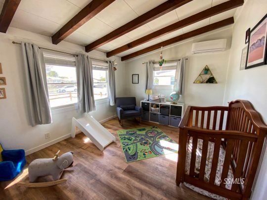 313 North Florence Street Ridgecrest, CA 93555 - Photo 26 of 38 a living room with furniture fireplace and wooden floor